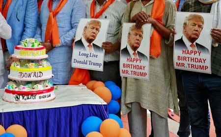 Members of Hindu Sena, a right wing Hindu group, celebrate Donald Trump's birthday in New Delhi, India June 14, 2016. REUTERS/Cathal McNaughton