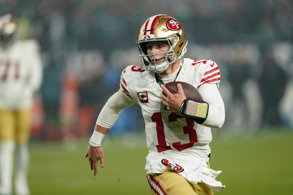 San Francisco 49ers quarterback Brock Purdy scrambles for yardage against the Philadelphia Eagles during the first half of an NFL football game, Sunday, Dec. 3, 2023, in Philadelphia. (AP Photo/Chris Szagola)