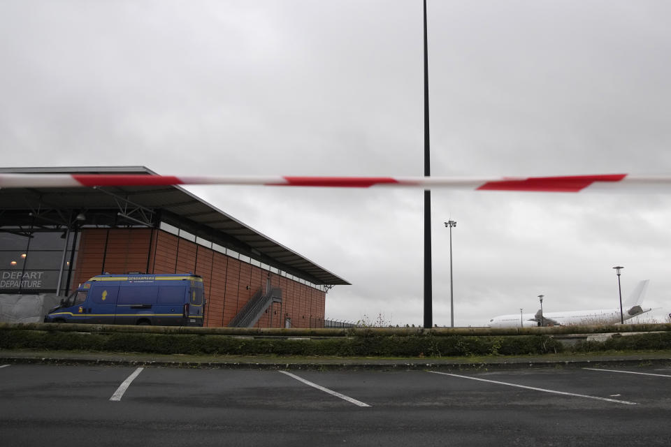 The plane reported to carry some 300 Indian citizens parks at the Vatry airport, eastern France, Saturday, Dec. 23, 2023 in Vatry. About 300 Indian citizens heading to Central America were sequestered in a French airport for a third day Saturday because of an investigation into suspected human trafficking, authorities said. The 15 crew members of the Legend Airlines charter flight en route from United Arab Emirates to Nicaragua were questioned and released, according to a lawyer for the small Romania-based airline. (AP Photo/Christophe Ena)