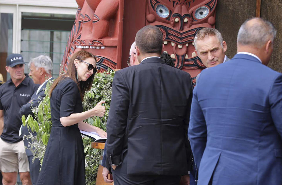 New Zealand Prime Minister Jacinda Ardern, third left, attends a service in Whakatane, Wednesday, Dec. 9, 2020, to mark the first anniversary of a deadly volcanic eruption. An eruption killed 22 people on White Island, a popular tourist destination, when superheated steam spewed out from the crater floor. (Andrew Warner/NZME via AP)