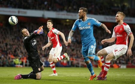 Arsenal v Sunderland - Barclays Premier League - Emirates Stadium - 20/5/15. Sunderland's Steven Fletcher has a shot saved by Arsenal's David Ospina. Action Images via Reuters / John Sibley Livepic