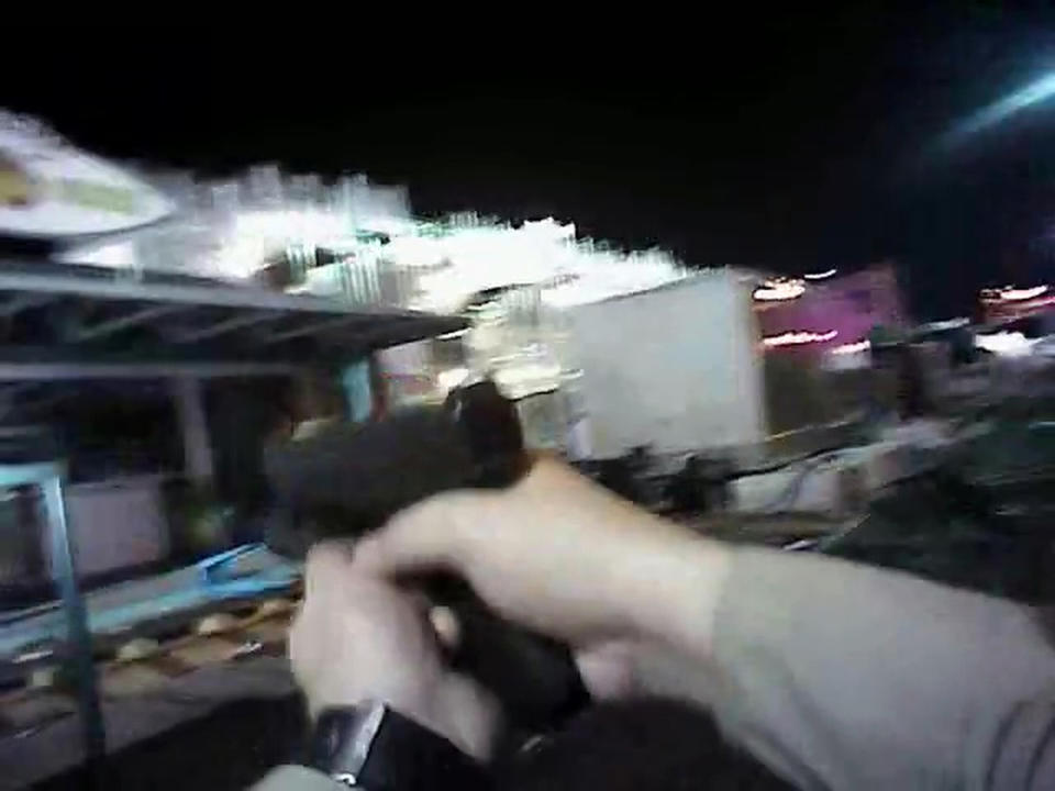 FILE- In this Oct. 1, 2017, file image taken from police body cam video released by the Las Vegas Metropolitan Police Department on July 25, 2018, an armed law enforcement official points his gun while searching for a shooter in Las Vegas. The FBI has concluded its investigation into the deadliest mass shooting in modern U.S. history without determining a motive. The FBI makes the conclusion in a report given to The Associated Press on Tuesday, Jan. 29, 2019. After nearly 16 months, the agency says it can't determine why gunman Stephen Paddock killed 58 people and injured nearly 900 others in October 2017. (Las Vegas Metropolitan Police Department via AP, File)