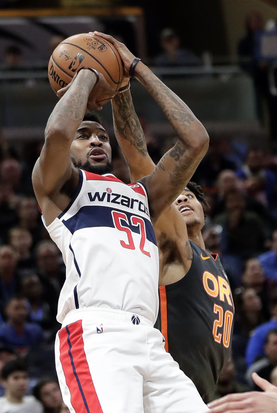 Orlando Magic guard Markelle Fultz (20) blocks a shot attempt by Washington Wizards guard Jordan McRae (52) during the first half of an NBA basketball game Wednesday, Jan. 8, 2020, in Orlando, Fla. (AP Photo/John Raoux)