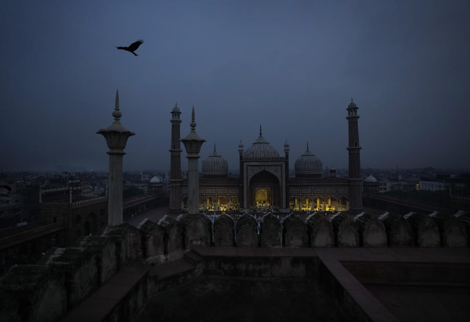 Muslims gather early morning to offer Eid al-Adha prayers at the Jama Masjid or Mosque, in New Delhi, India, Thursday, June 29, 2023. Muslims around the world will celebrate Eid al-Adha, or the Feast of the Sacrifice, slaughtering sheep, goats, cows and camels to commemorate Prophet Abraham's readiness to sacrifice his son Ismail on God's command. (AP Photo/Manish Swarup)