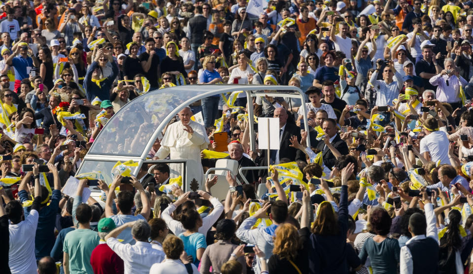 Pope Francis arrives in Monza, 30 kilometers north of Milan, Italy, to celebrate a Mass as part of his one-day pastoral visit to Monza and Milan, Italy’s second-largest city, Saturday, March 25, 2017. Pope Francis focused his one-day visit Saturday to the wealthy northern Italian city of Milan on those marginalized by society, visiting families in a housing project and exhorting clergy and nuns gathered in a cathedral to minister to the peripheries. (AP Photo/Giuseppe Aresu)