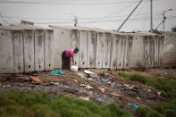 <p>Toilets in an informal settlement in Langa, a township outside of Cape Town, South Africa. (Photo: Rodger Bosch/AFP/Getty Images) </p>