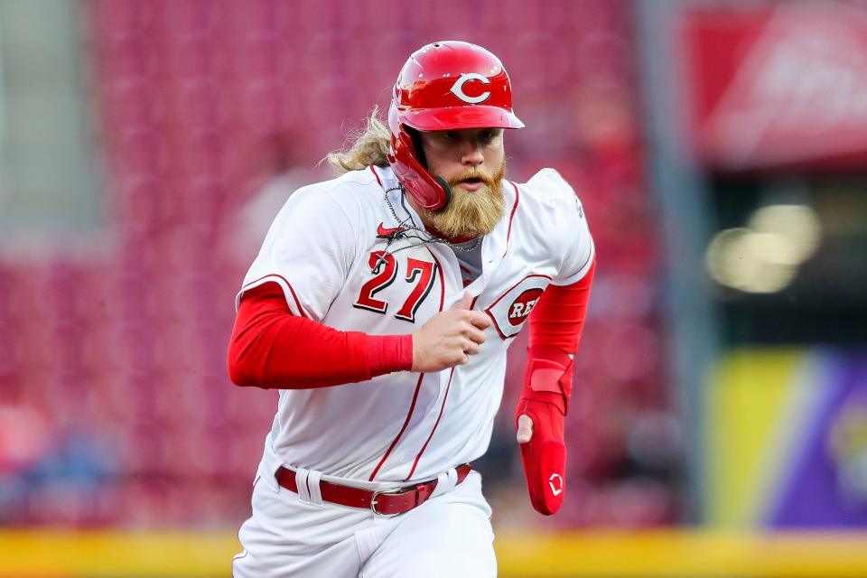 Apr 26, 2022; Cincinnati, Ohio, USA; Cincinnati Reds designated hitter Jake Fraley (27) runs to third against the San Diego Padres in the third inning at Great American Ball Park.