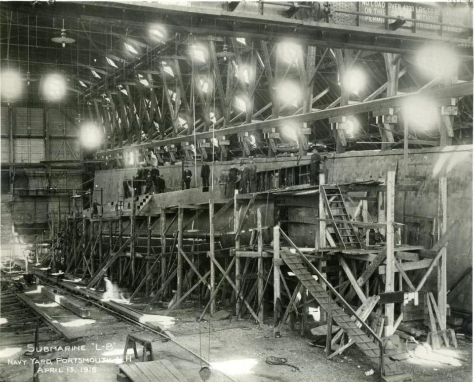 This 1916 interior view of the Franklin Shiphouse at Portsmouth Naval Shipyard shows scaffolding surrounding the USS L-8, the first submarine constructed by the government at any naval station.