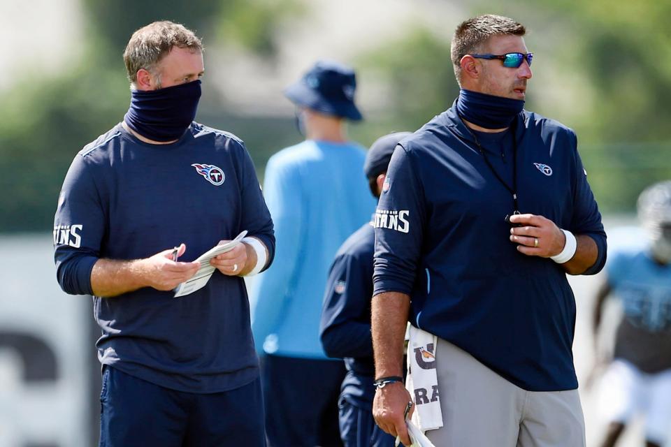 Tennessee Titans outside linebackers coach Shane Bowen, left, and head coach Mike Vrabelon on Aug. 24, 2020, in Nashville, Tenn.