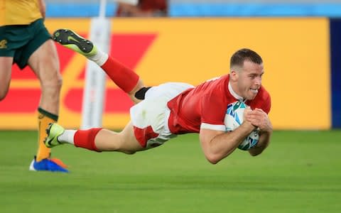 Wales' Gareth Davies scores his sides second try during the 2019 Rugby World Cup match at the Tokyo Stadium - Credit: PA