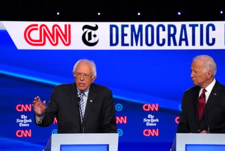 Democratic presidential candidate former Vice President Biden looks on as Senator Bernie Sanders speaks during the fourth U.S. Democratic presidential candidates 2020 election debate at Otterbein University in Westerville, Ohio U.S.