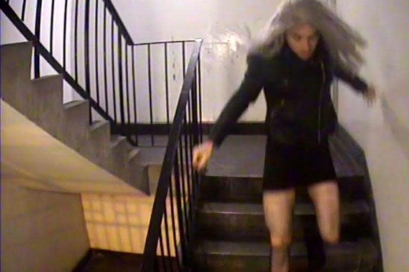 Caught on camera: Mark Brown, in a wig and dress, leaving his north London home before following his 18-year-old alleged victim after a freshers' week night out