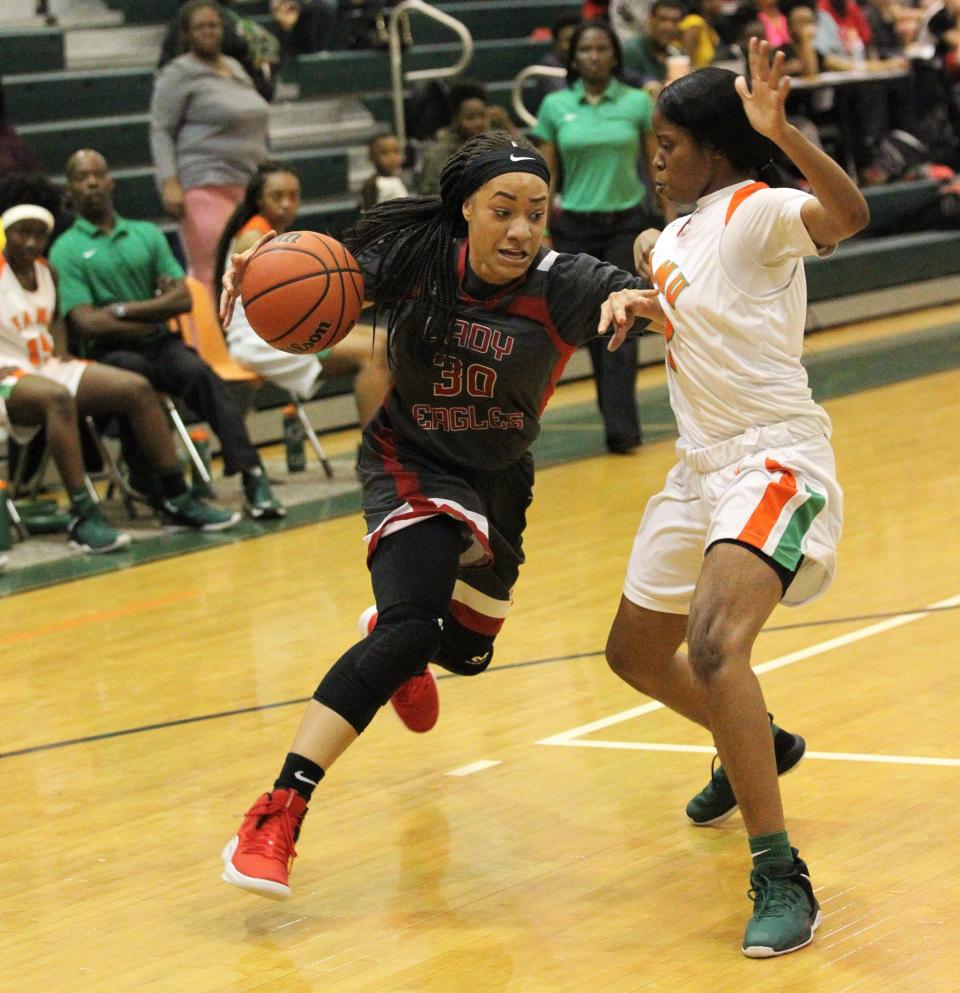 NFC senior Caylan Jones drives to the basket as FAMU DRS' girls basketball team beat NFC 59-41 for a District 1-3A title on Jan. 7, 2019.