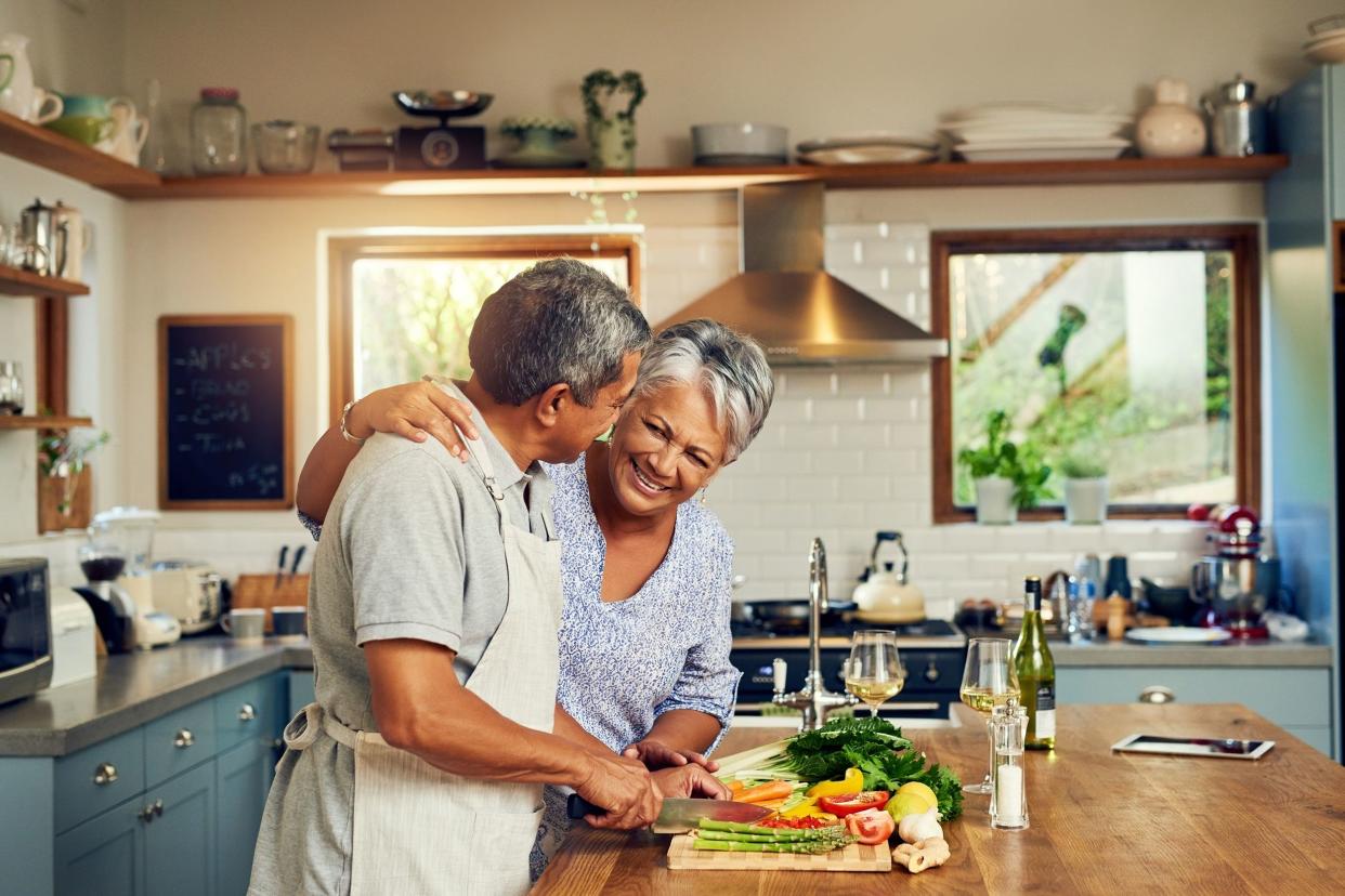 senior couple cooking at home