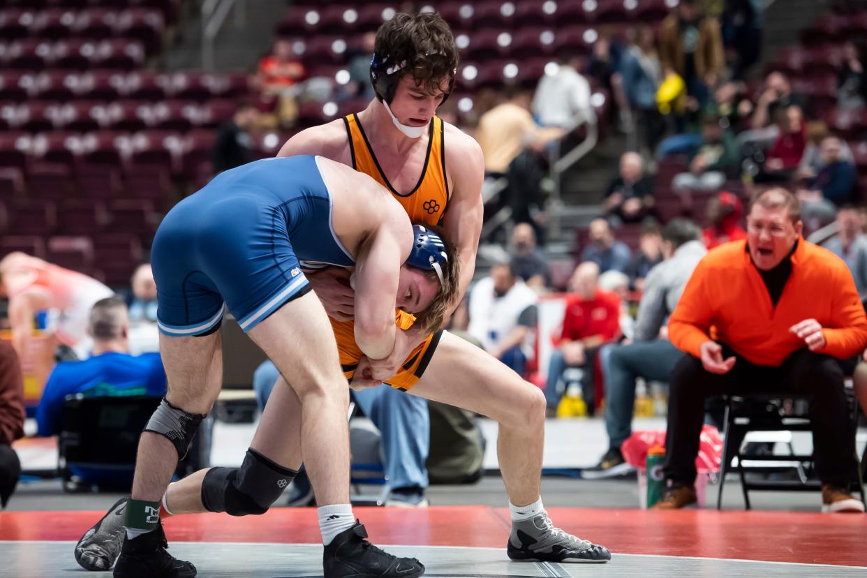 Cathedral Prep's Kaemen Smith, back, wrestles North Penn's William Morrow during a 152-pound round of 16 bout at the PIAA Class 3A Wrestling Championships at the Giant Center on Thursday, March 10, 2022, in Derry Township. Smith won by decision, 4-3.