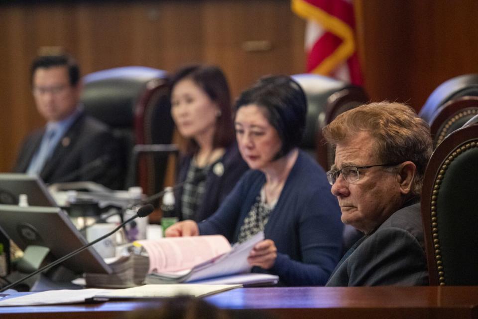 O.C. Supervisor Doug Chaffee, right, attends a board meeting in Santa Ana in July 2020.