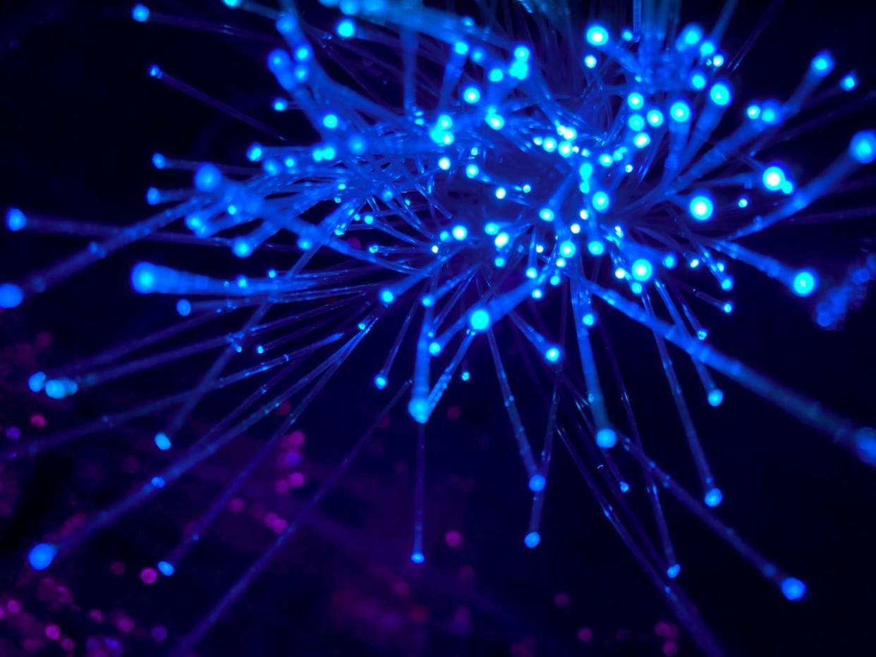  Fibre optic cables glowing like hundreds of stars. 