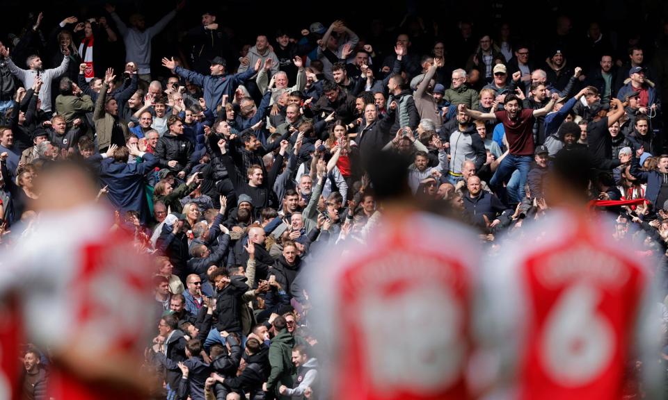 <span>Arsenal fans celebrate after their side’s third against <a class="link " href="https://sports.yahoo.com/soccer/teams/tottenham/" data-i13n="sec:content-canvas;subsec:anchor_text;elm:context_link" data-ylk="slk:Spurs;sec:content-canvas;subsec:anchor_text;elm:context_link;itc:0">Spurs</a> in April.</span><span>Photograph: Tom Jenkins/The Guardian</span>