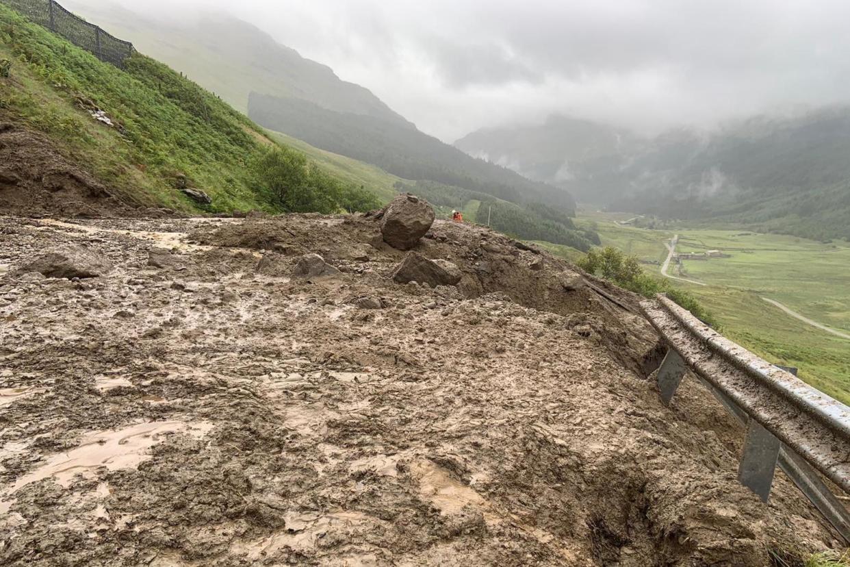 An estimated 6,000 tonnes of soil and rock was washed off the hillside: PA