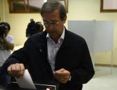 Leader of center-right Social Democratic Party candidate, Pedro Passos Coelho casts his ballot at a polling station in Massama on the outskirts of Lisbon on October 4, 2015