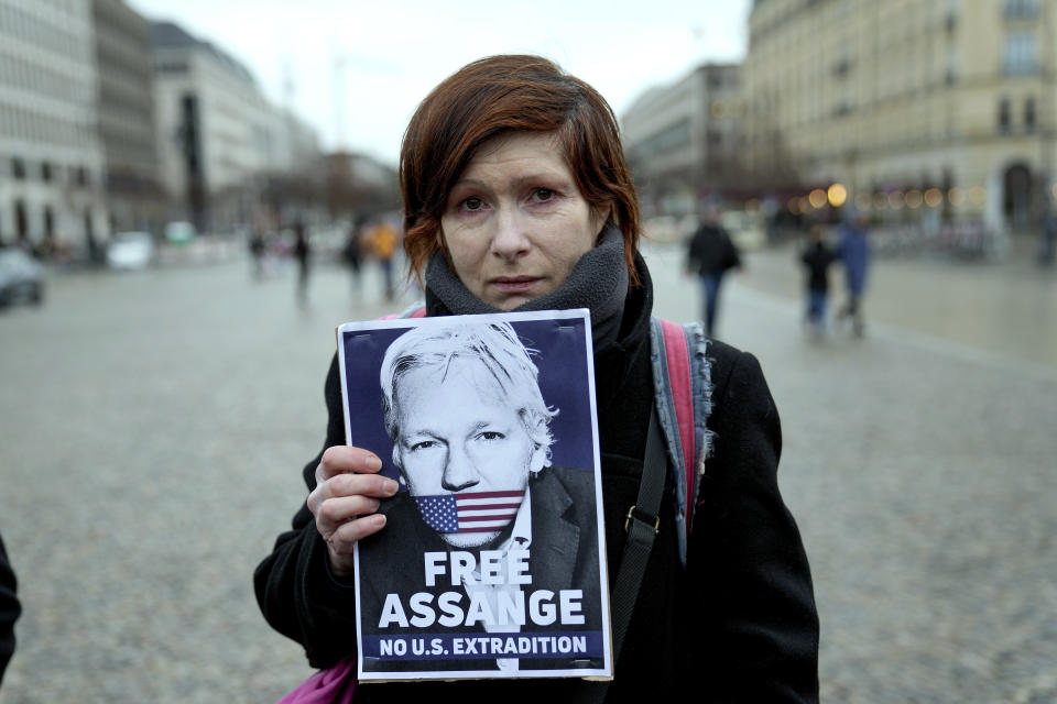 A demonstrator holds a poster during a rally in support of Julian Assange in front of the U.S embassy, in Berlin, Tuesday, Feb. 20, 2024. Assange's lawyers will begin their final U.K. legal challenge on Tuesday to stop the WikiLeaks founder from being sent to the United States to face spying charges. (AP Photo/Ebrahim Noroozi)