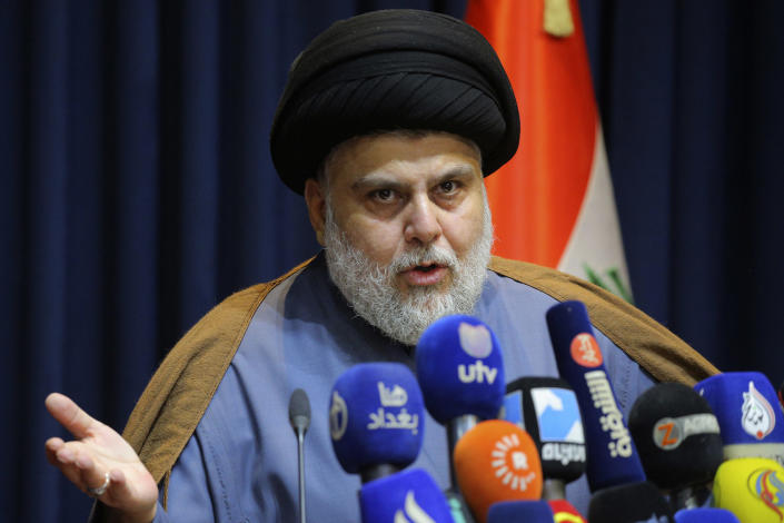 FILE - Populist Shiite cleric Muqtada al-Sadr, speaks during a mews conference in Najaf, Iraq, Nov. 18, 2021. Iraq’s Parliament is set to hold a session Thursday, June 23, 2022, to vote in replacements for 73 lawmakers who resigned earlier this month. The collective walkout by followers of al-Sadr, Iraq’s most influential Shiite politician, threw Iraq into further uncertainty, deepening a months-long political crisis over government formation. (AP Photo/Anmar Khalil, File)
