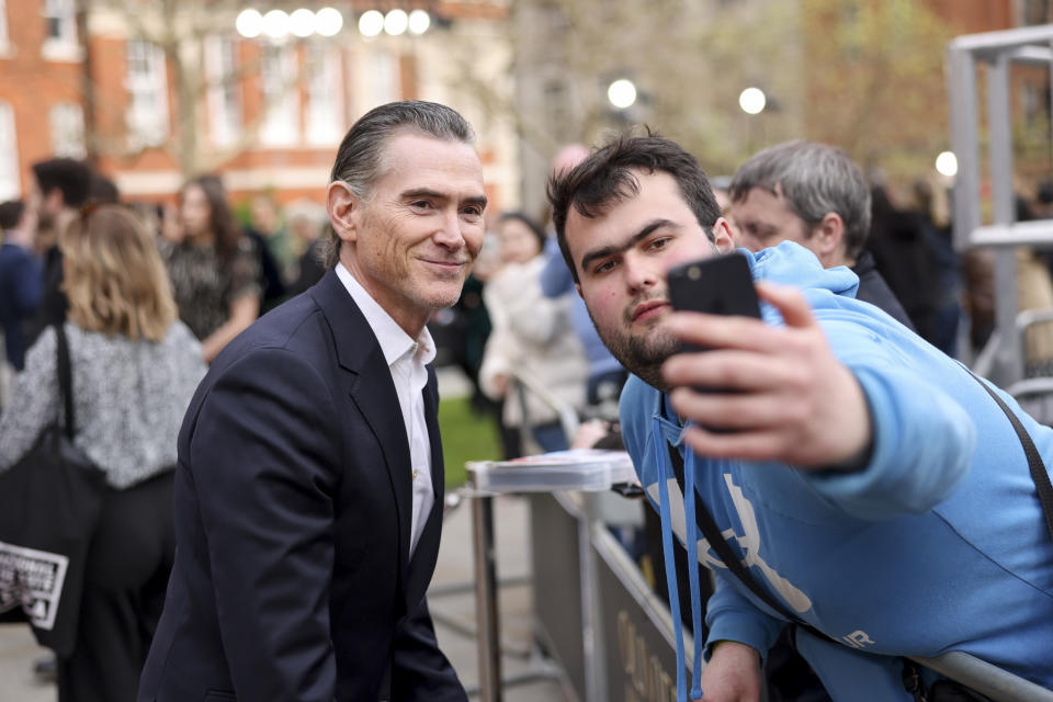 Billy Crudup, left, poses for a selfie upon arrival at the Olivier Awards on Sunday, April 14, 2024, in London. (Photo by Vianney Le Caer/Invision/AP)