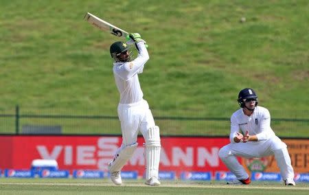 Cricket - Pakistan v England - First Test - Zayed Cricket Stadium, Abu Dhabi, United Arab Emirates - 14/10/15 Pakistan's Shoaib Malik in action as England's Jonny Bairstow looks on Action Images via Reuters / Jason O'Brien Livepic