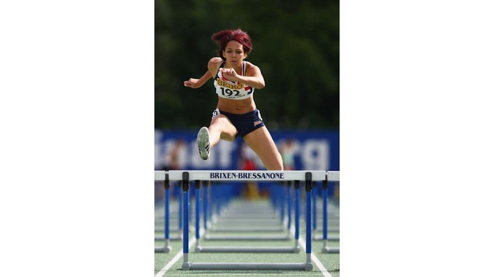 Katarina Johnson-Thompson jumping over a hurdle