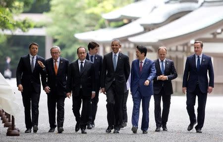 From left, Italian Premier Matteo Renzi, European Commission President Jean-Claude Juncker, French President Francois Hollande, Canadian Prime Minister Justin Trudeau, German Chancellor Angela Merkel U.S. President Barack Obama, Japanese Prime Minister Shinzo Abe, European Council President Donald Tusk, and British Prime Minister David Cameron, walk past the Kaguraden as they visit Ise Jingu shrine in Ise, Mie Prefecture, Japan, Thursday, May 26, 2016, as part of the G-7 Summit. REUTERS/Carolyn Kaster/Pool