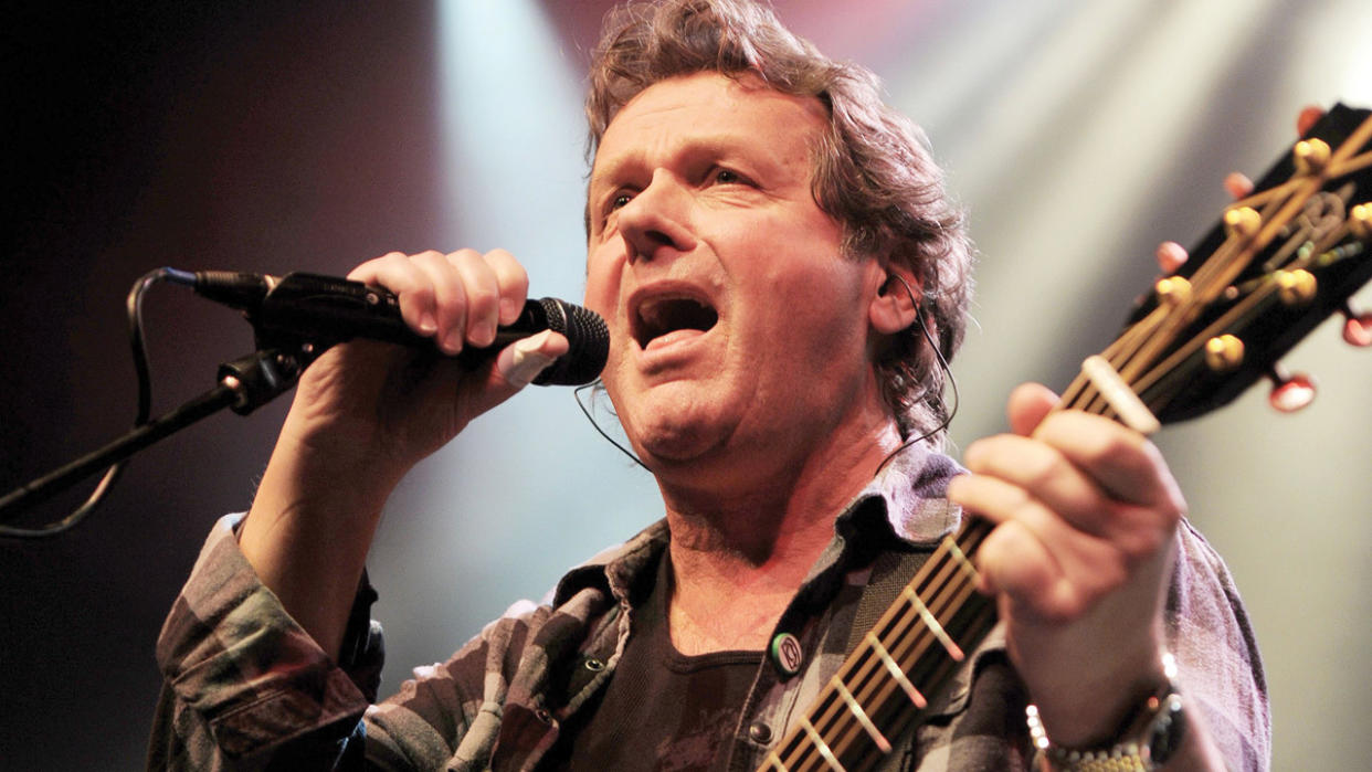  A photograph of John Wetton performing. 