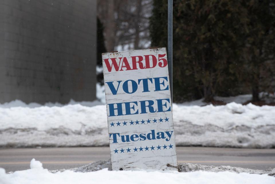 A sign on Pine Street in front of Burlington Electric Department in Burlington identifies a polling station on Town Meeting Day, Tuesday, March 7, 2023.