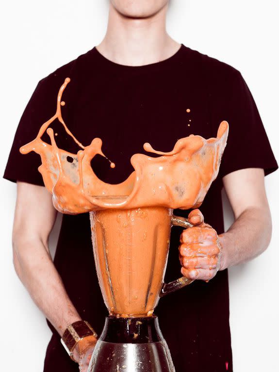 Man holding splashing blender; Shutterstock ID 382280089