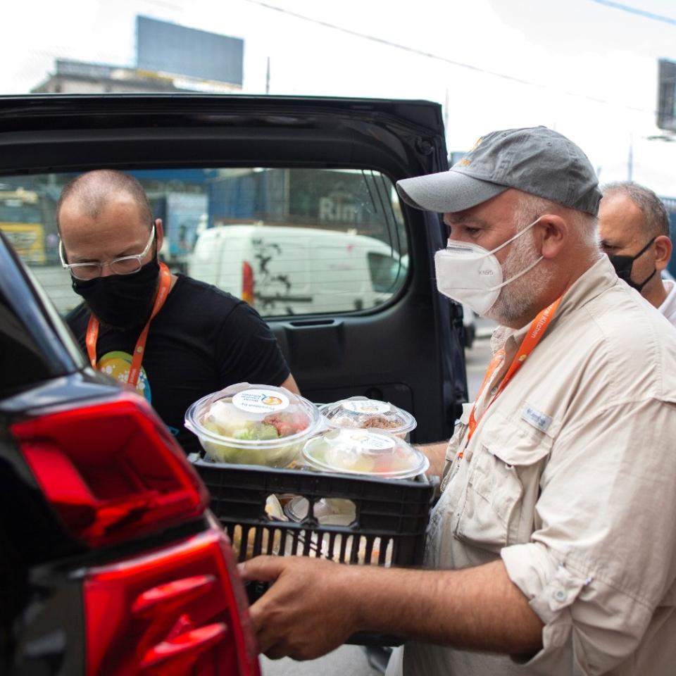 Man holding a basket of food