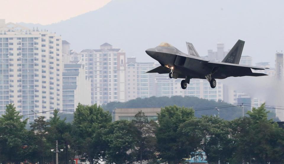 FILE- In this May 16, 2018, file photo, a U.S. F-22 Raptor stealth fighter jet lands as South Korea and the United States conduct the Max Thunder joint military exercise at an air base in Gwangju, South Korea.