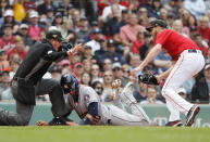 Houston Astros' Yuli Gurriel, center, is called safe by umpire Cory Blaser, left, after scoring on a wild pitch by starting pitcher Chris Sale, right, during the second inning of a baseball game Sunday, May 19, 2019, at Fenway Park in Boston. (AP Photo/Winslow Townson)