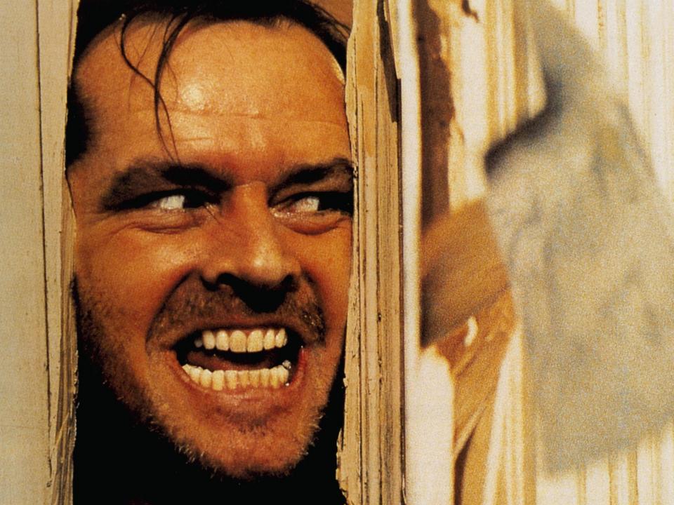 The "Here's Johnny" scene from the shining with face in a door