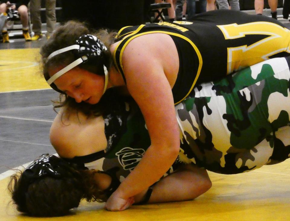 Watkins Memorial senior Claire Campbell takes Harrison sophomore Gabriella Chandler to her back at 170 pounds during Watkins' first girls high school wrestling tournament Wednesday, Dec. 29, 2021.