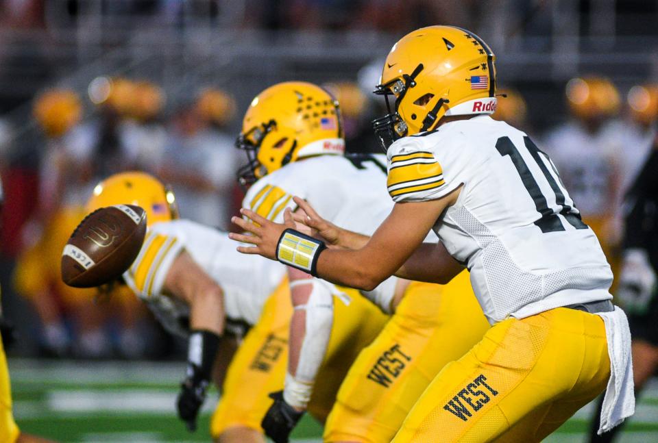 Central Bucks West's Cooper Taylor (10) prepares for the snap against Pennsbury on Sept. 14.