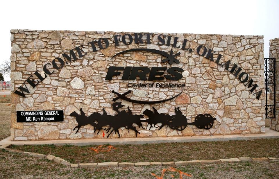 A welcome sign stands next to a gate to Fort Sill, a U.S. Army post in southwest Oklahoma.