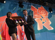 LONDON, ENGLAND - JULY 27: Dame Kelly Holmes and LOCOG Chairman Sebastian Coe present the olympic medals during the' London 2012 - One Year To Go' ceremony in Trafalgar Square on July 27, 2011 in London, England. The one year countdown to the London 2012 Olympic games was marked with a unique ceremony in Trafalgar Square, with IOC President Jacques Rogge inviting the world's athletes to compete in next summer's games. (Photo by Dan Kitwood/Getty Images)