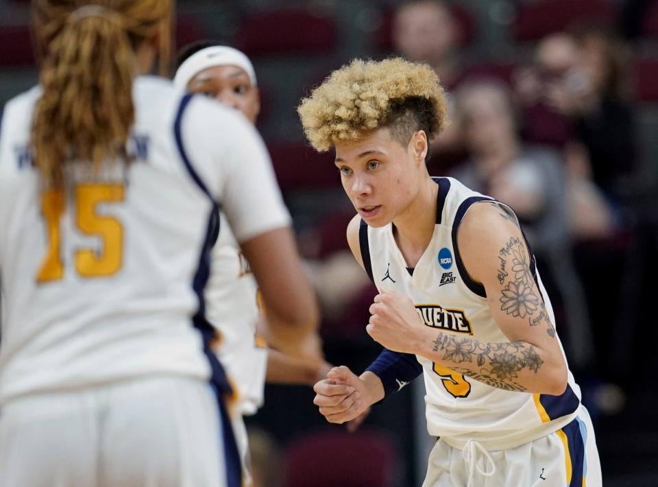 Marquette's Natisha Hiedeman reacts after making a free throw against Rice during the closing seconds in overtime of a first-round women's college basketball game in the NCAA Tournament.