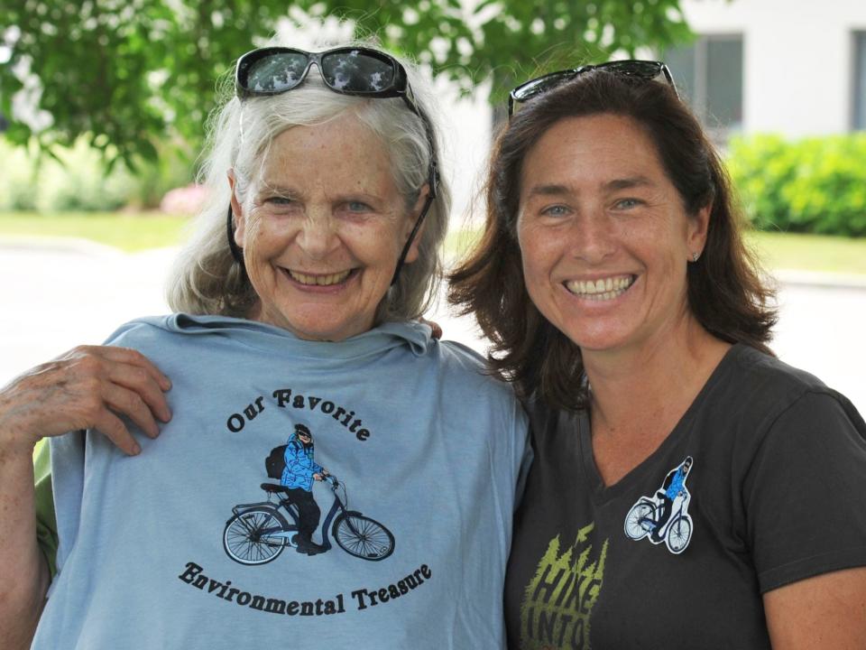 Quincy Environmental Treasures Program founder Sally Owen, of Quincy, left, is joined by her assistant, Maura O'Gara, of Quincy, right, as Owen celebrates her 75th birthday after a tour of Merrymount Park led by Quincy Mayor Thomas Koch, Sunday, July 9, 2023.