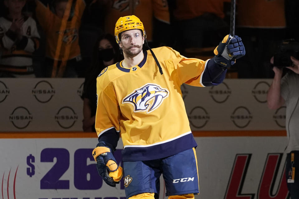 Nashville Predators left wing Filip Forsberg waves to the crowd as he is named the first star of the game after an NHL hockey game against the Columbus Blue Jackets Tuesday, Nov. 30, 2021, in Nashville, Tenn. Forsberg scored four goals in the game. (AP Photo/Mark Humphrey)