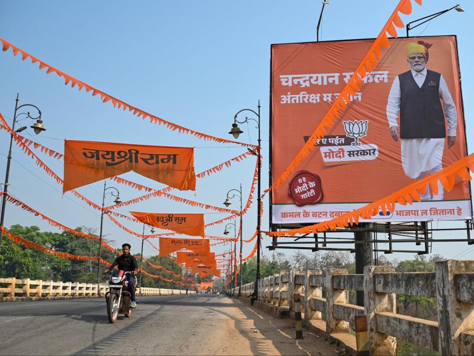 A poster of prime minister Narendra Modi is put up in Dantewada, Chhattisgarh, ahead of India’s national elections, on 16 April 2024 (AFP via Getty Images)