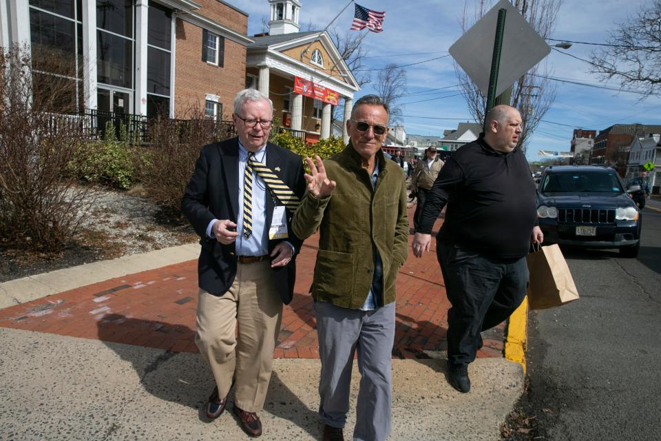 Bruce Springsteen attends an event on March 8, 2022, to announce the creation of an exhibition space in Freehold to celebrate his life. The Boss is shown walking downtown with his cousin, Glenn Cashion.