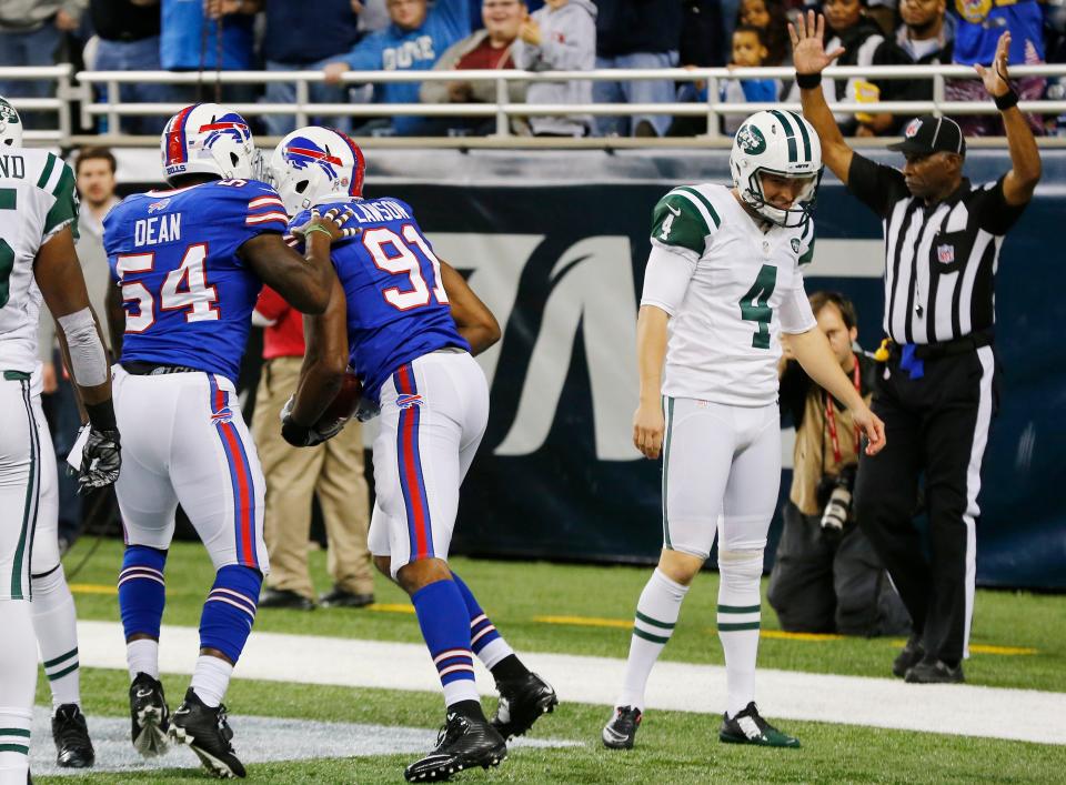 Buffalo Bills defensive end Manny Lawson celebrates his touchdown recovery of a blocked punt in the Bills 38-3 rout of the Jets in a game played in Detroit on Nov. 24, 2014.