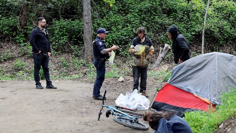 FILE PHOTO: Homeless people are evacuated from a park in Grants Pass