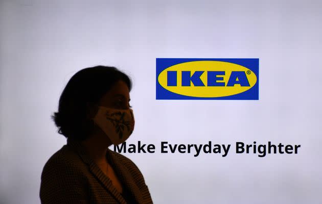 MUMBAI, MAHARASHTRA, INDIA - 2021/12/08: A woman wearing a protective face mask is seen next to the IKEA logo at the recently opened IKEA store. It is the second store launched in the city by the famous Swedish brand. (Photo by Ashish Vaishnav/SOPA Images/LightRocket via Getty Images) (Photo: SOPA Images via Getty Images)