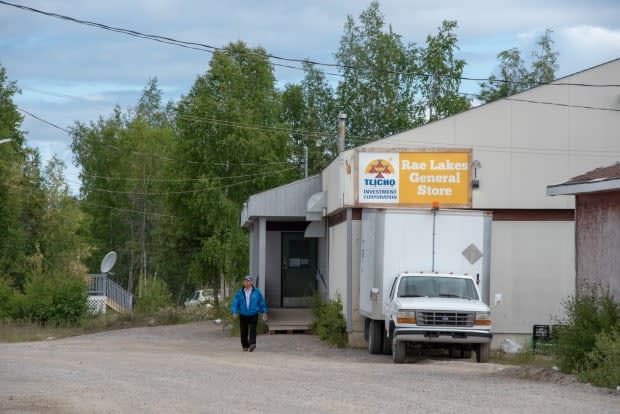 A man walks by the Gamètì, N.W.T., general store on July 12, 2019. If needed, the byelection to replace former Monfwi electoral district MLA Jackson Lafferty will be on July 27. Gamètì is one of four Tłıchǫ communities in the district. (Walter Strong/CBC - image credit)